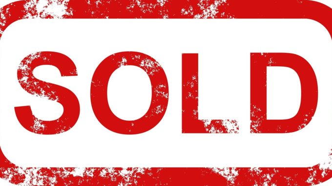 SOLD sign in red