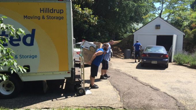 Hilldrup team unloading items from truck