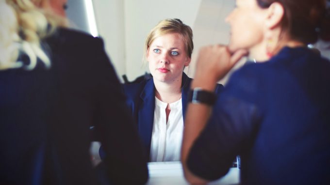 Employee listening to her managers