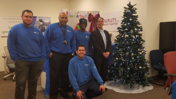 Group of Hilldrup Operations employees enjoy food at picnic table