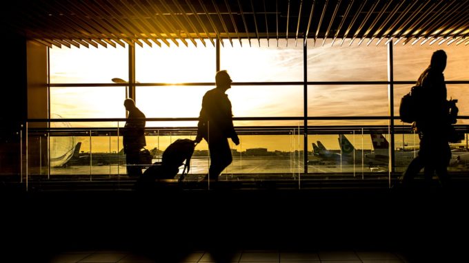 People walking through an airport