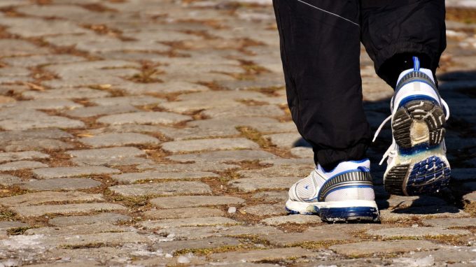 Person's sneakers in motion, running