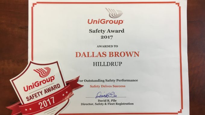 Dallas Brown with award from UniGroup