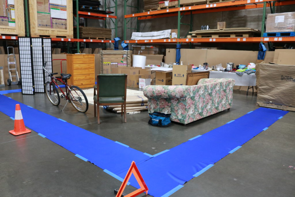 A packing demonstration is set up in a warehouse