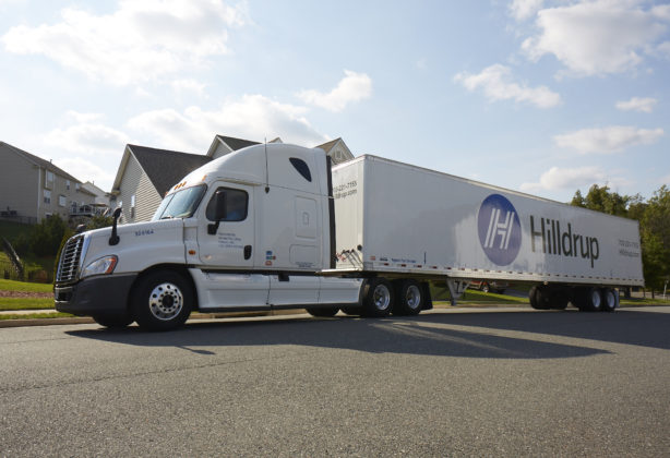 Hilldrup moving truck parked outside a home