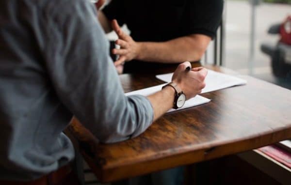 Two people collaborating at a table