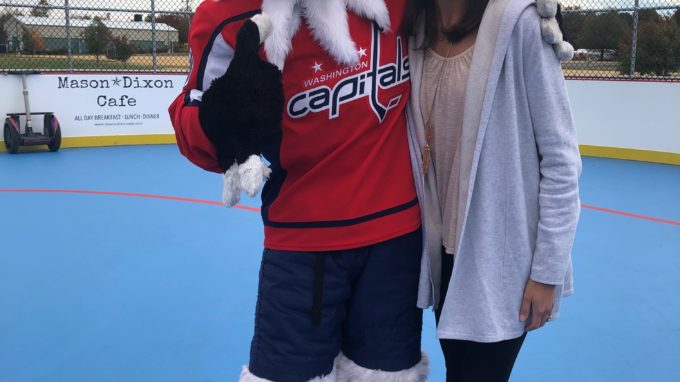 Slapshot, the Washington Capital's mascot, gives high five to kids at Dixon Park