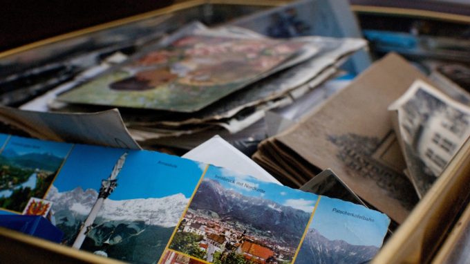 Box filled with old papers, documents, postcards, files