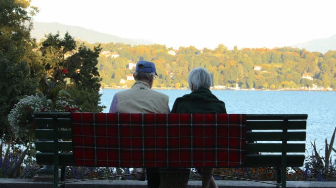 Older Couple looking at view of trees and water