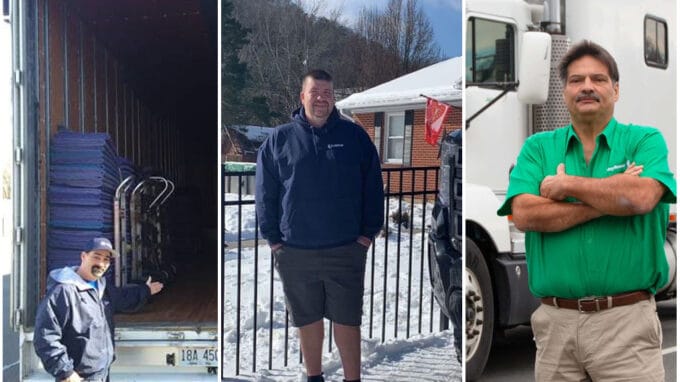 3 van operators standing in front of trucks