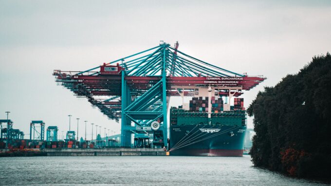 Far-away picture of a port and container ship.