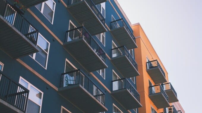 Exterior picture of a modern apartment building.