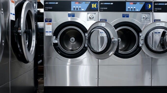 Washing machines on display in a store.