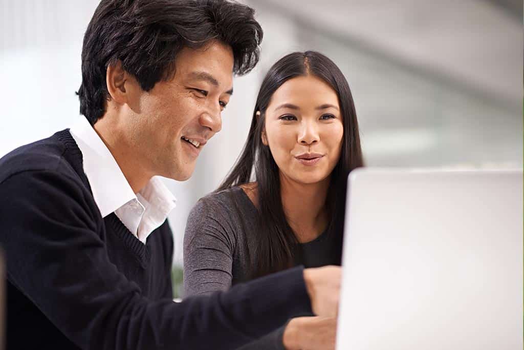 Young couple applying for financing online. 