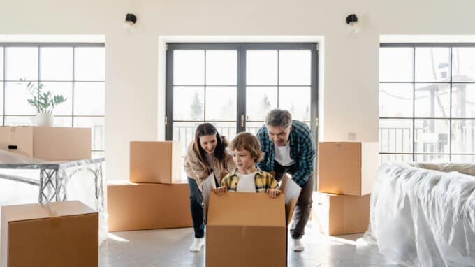 family with moving boxes