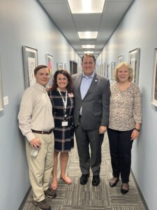 Connie and Chris with representatives from Stafford County schools at the 2022 student art show.