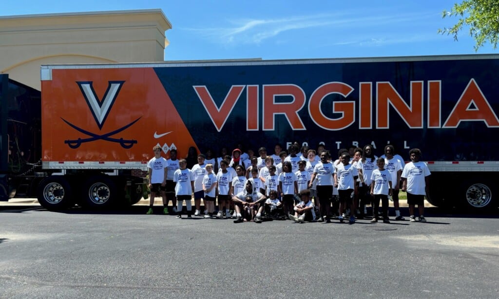 UVA football tractor trailer with Kam Robinson camp campers