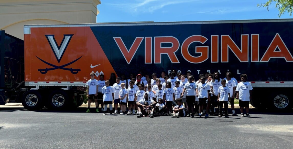 UVA football tractor trailer with Kam Robinson camp campers