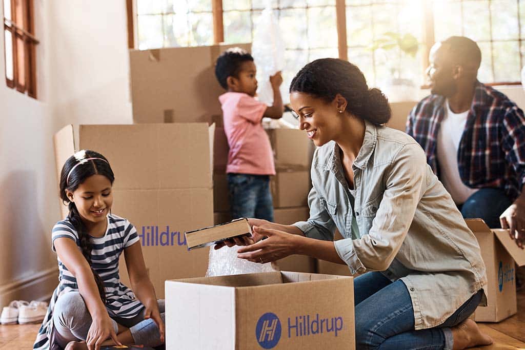 Family unpacking items in their new home