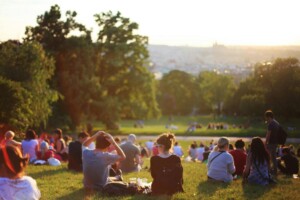 families sitting in the park