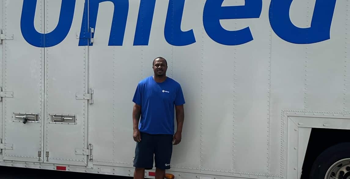 Wallace Wyatt in front of his truck