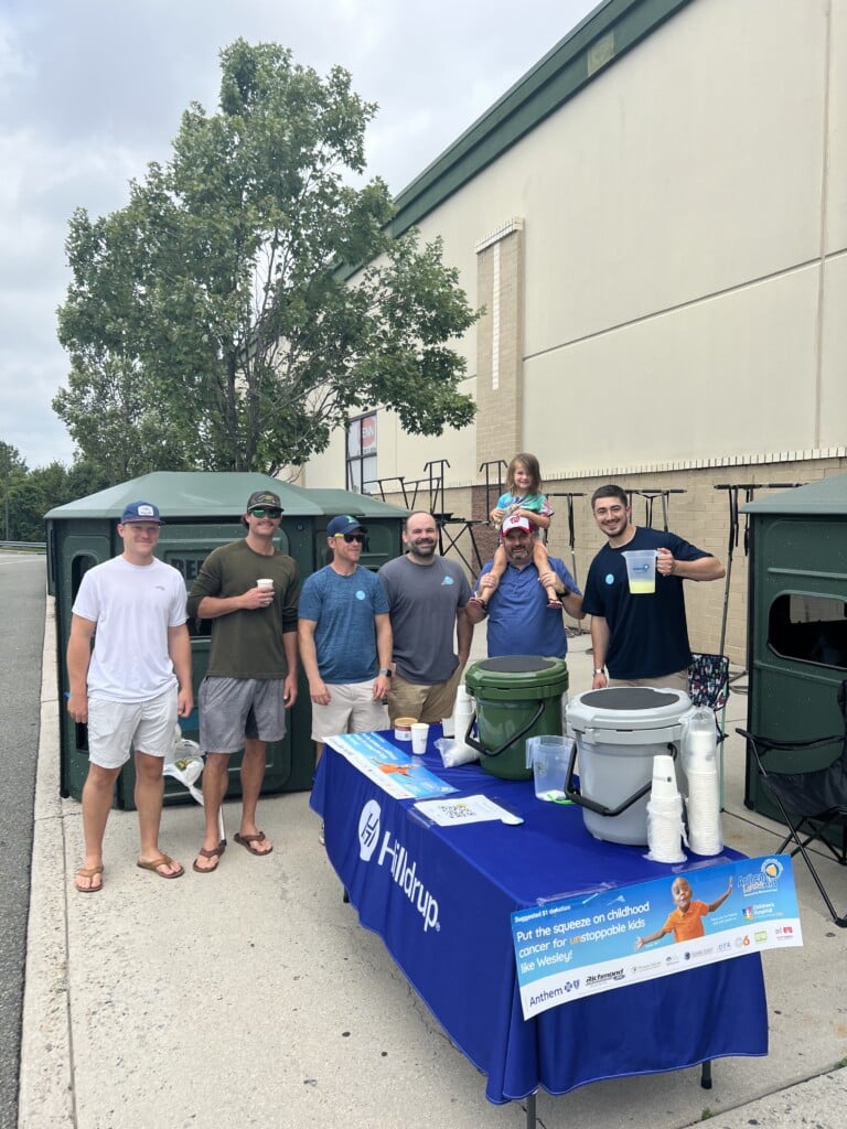 Richmond team in front of lemonade stand