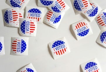 I Voted stickers on a white table