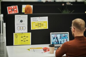 employee in the office on a call with remote employees