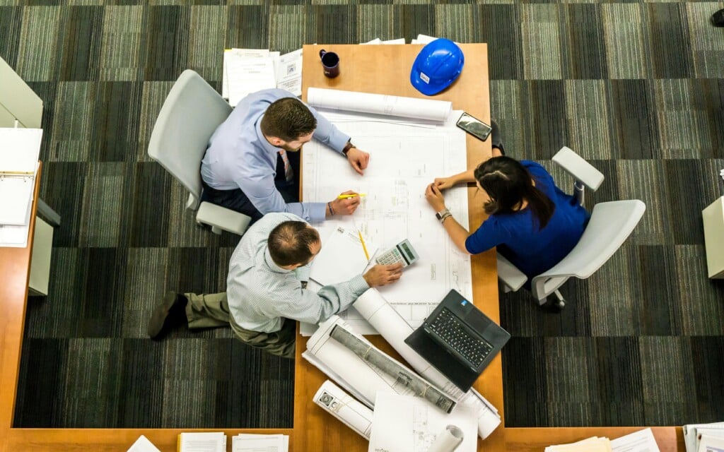 employees at a table working together