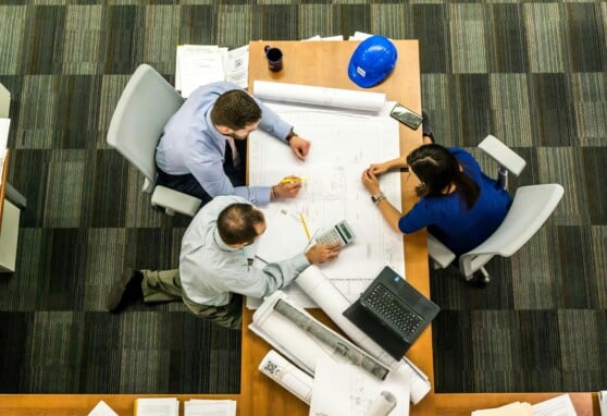 employees at a table working together