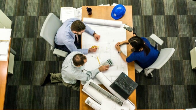 employees at a table working together