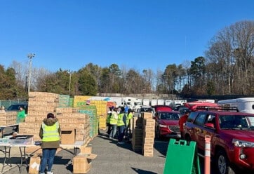 Cars file in at Hilldrup Charlotte during their Girl Scout Cookie Release