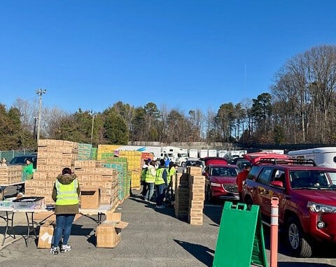 Cars file in at Hilldrup Charlotte during their Girl Scout Cookie Release