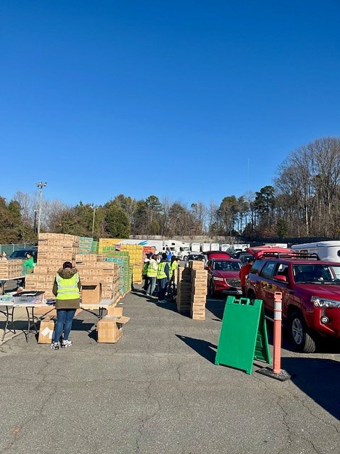 Cars file in at Hilldrup Charlotte during their Girl Scout Cookie Release 