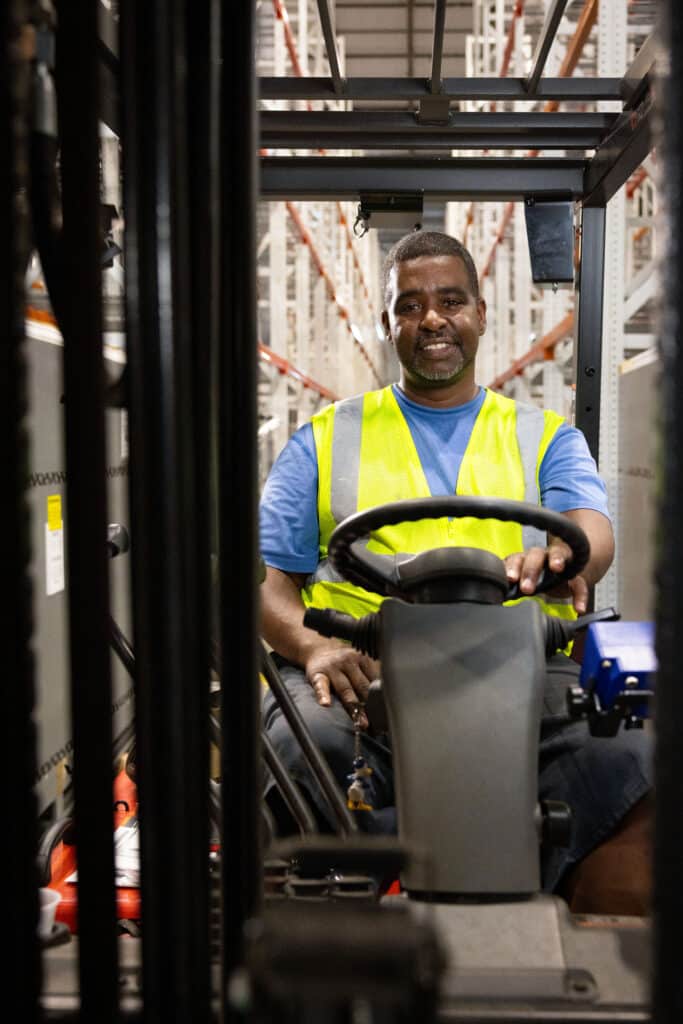 Forklift operator sitting in a forklift 
