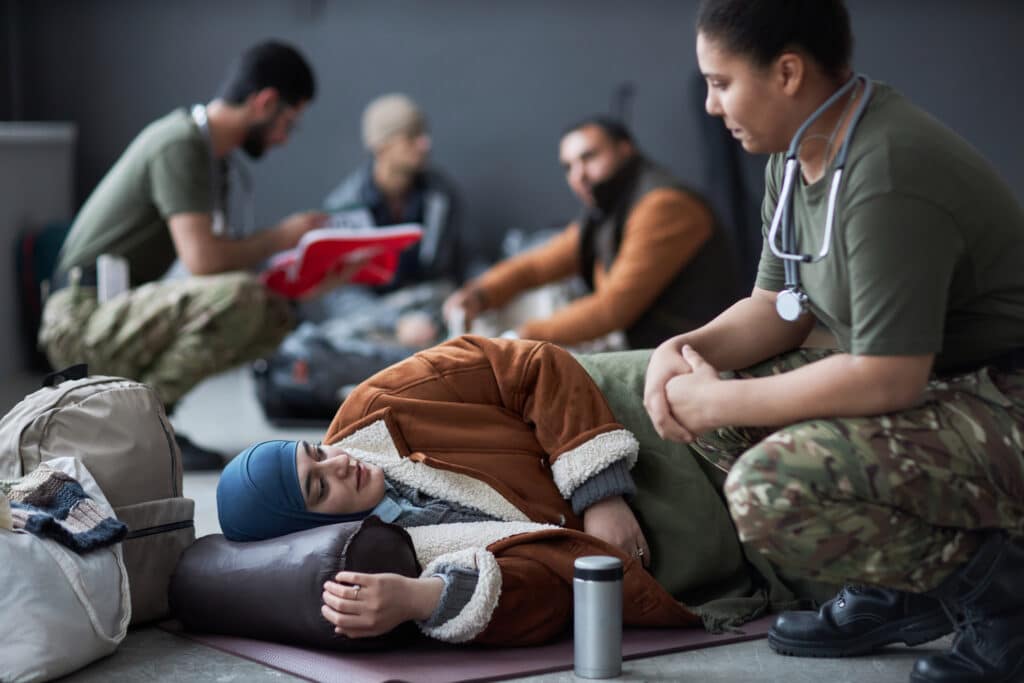 Woman lying on floor  and talking to a military doctor space
