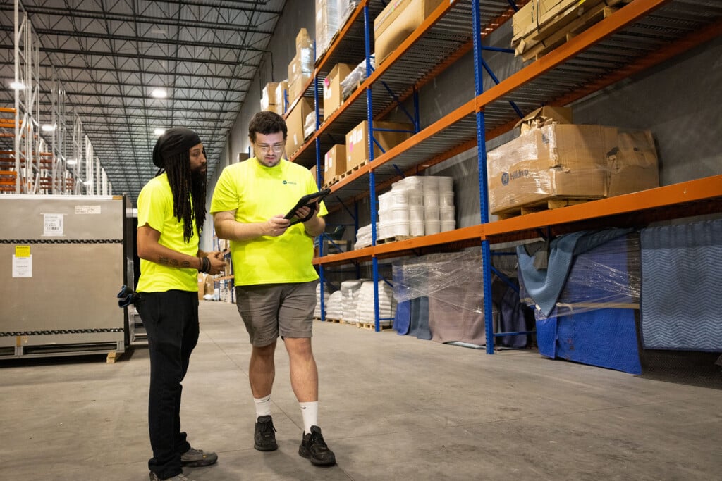 Warehouseman look at inventory on an iPad