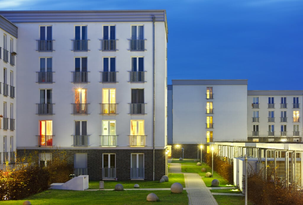 Modern university dormitory buildings at night.